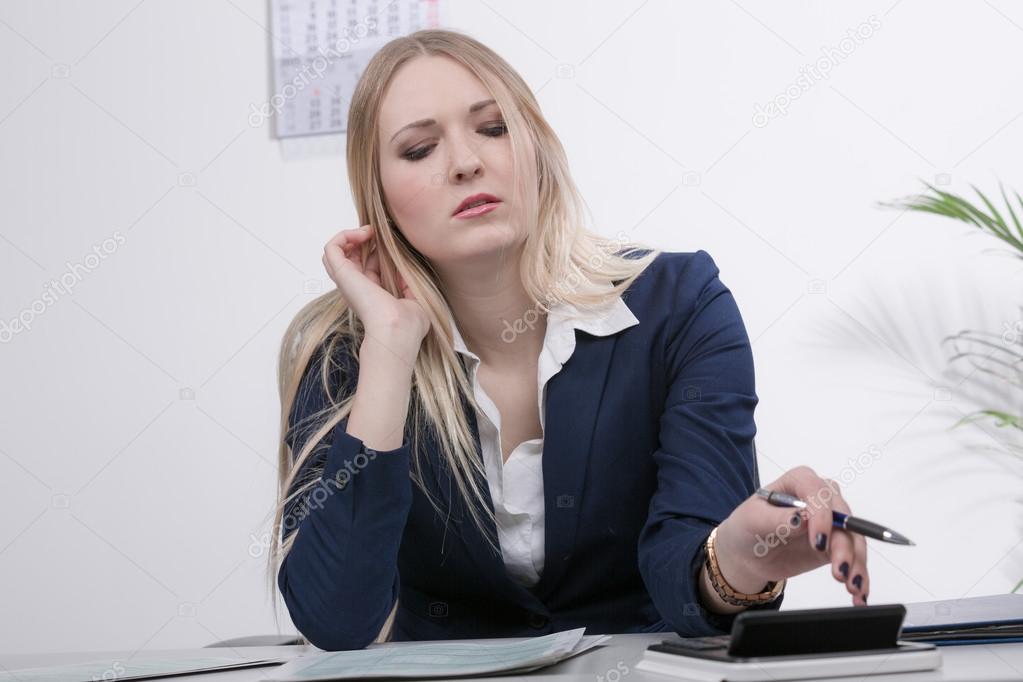 Young business woman at desk