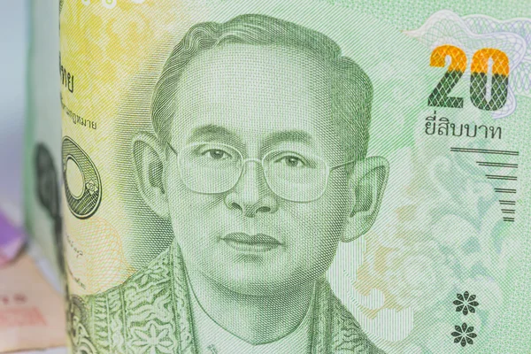 Крупним планом Таїланд валюти, тайський Бат із зображеннями король Таїланду. Деномінація 20 bahts. — стокове фото