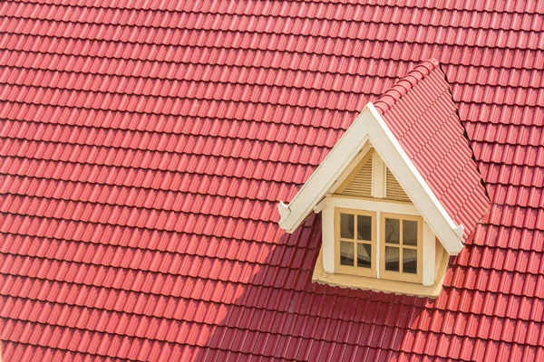 Dormer window on red roof — Stock Photo, Image