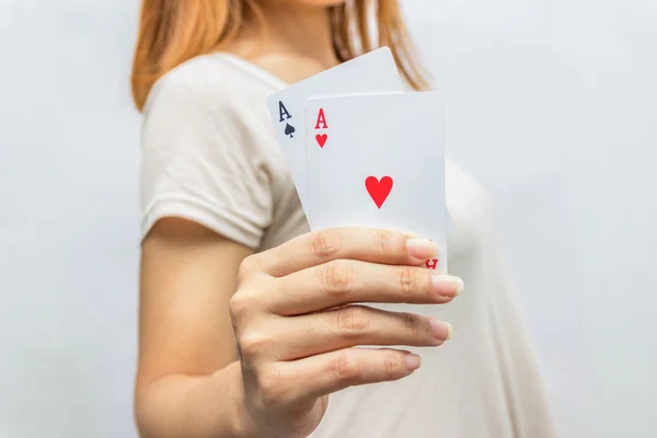 Young woman holding in hand poker card with combination of Full — Stock Photo, Image