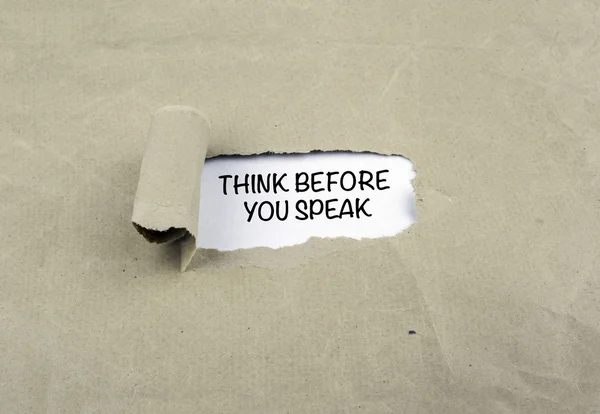 Inscription revealed on old paper - Think Before You Speak — Stock Photo, Image