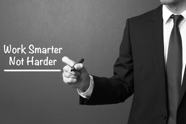 Business man writing: Work Smarter Not Harder — Stock Photo, Image