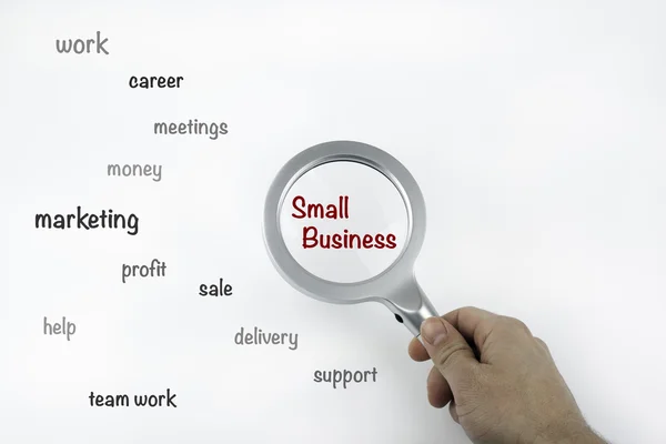 Arkusz z tekstu z lupą powiększenie słowo Small Business — Zdjęcie stockowe