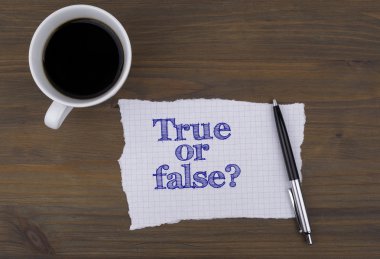 Tablo fincan kahve ile bir parça kağıt ve metin - True