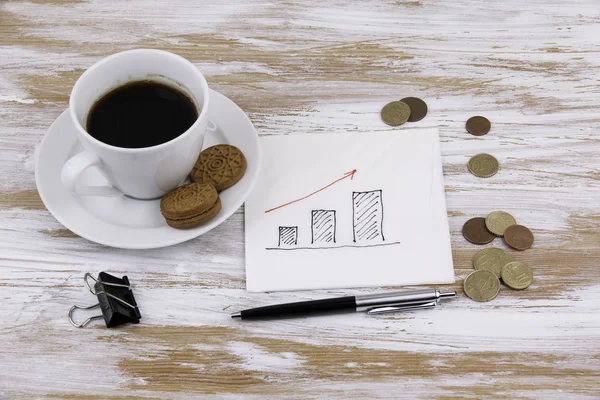 Grafikon egy szalvétára, egy csésze kávé — Stock Fotó