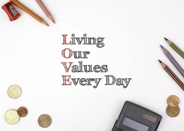 The sheet of paper with the inscription. LOVE - Living our value — Stock Photo, Image