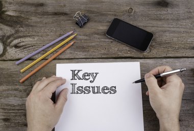 Key Issues. Text on a sheet of paper.  clipart