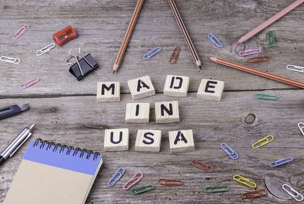 Text: MADE IN USA from wooden letters on wooden background
