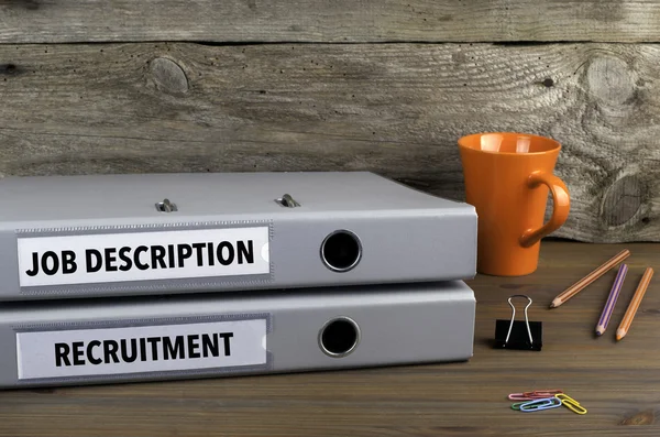 Job Description and Recruitment - two folders on wooden office d — Stock Photo, Image