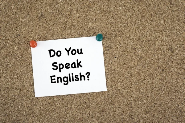 Do You Speak English? Sticky note on cork board