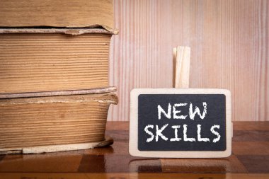 Yeni yetenekler. Kitap yığını ve satranç tahtası