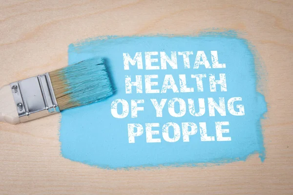 青年的精神健康。蓝色和木制底座上的刷子 — 图库照片