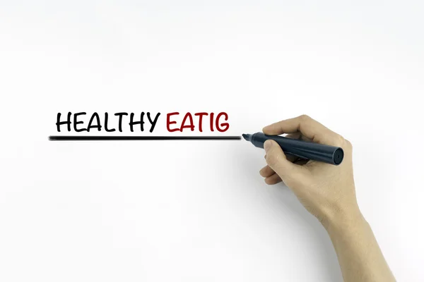 Ruka se značkou psaní, zdravé stravování — Stock fotografie