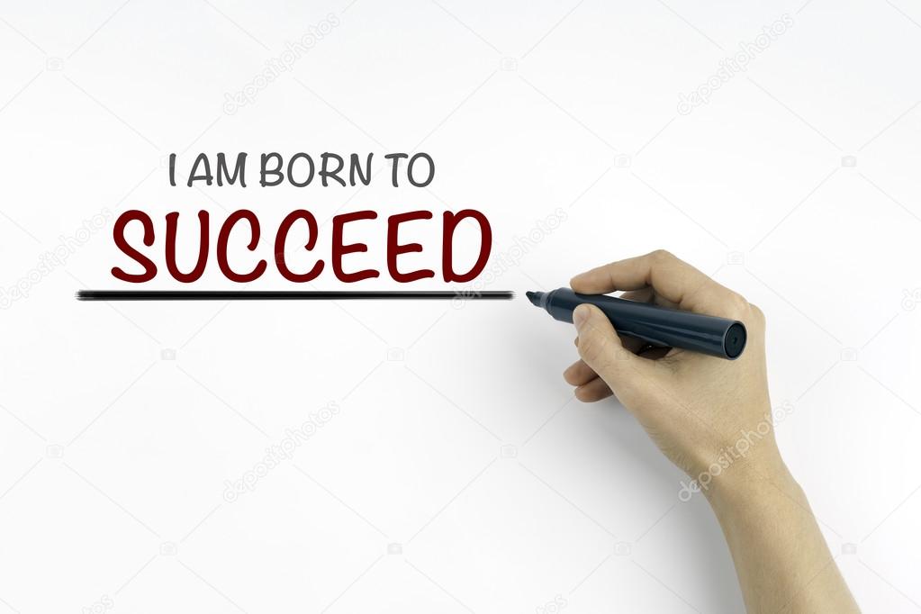 Hand with marker writing: I am born to succeed 