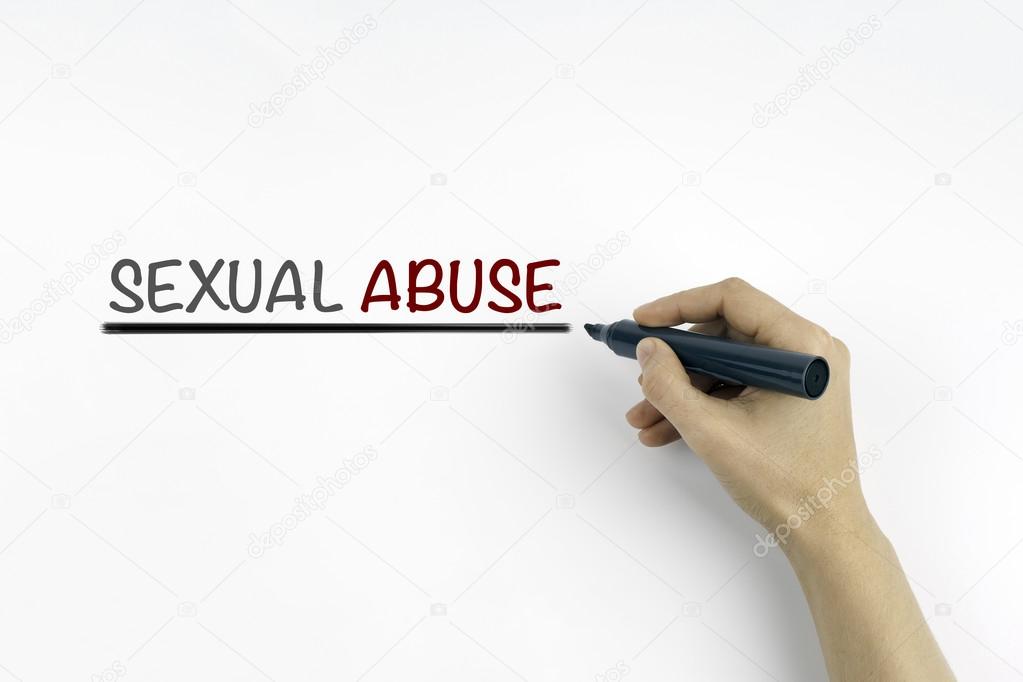 Hand with marker writing: Sexual Abuse