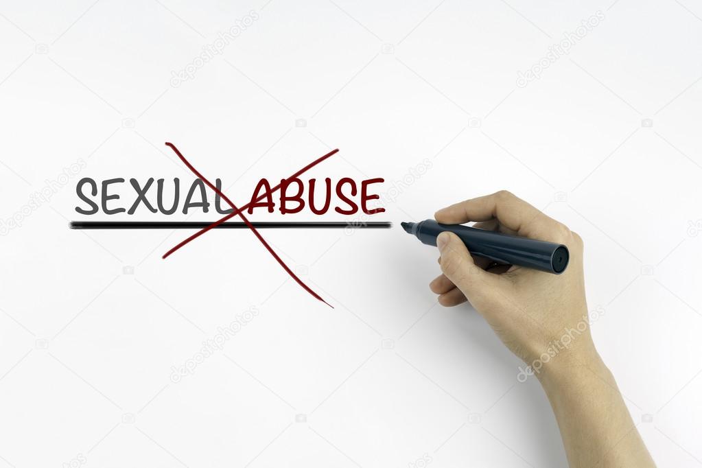 Hand with marker writing: Sexual Abuse