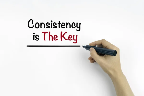 Hand with marker writing: Consistency is The Key — Stock Photo, Image