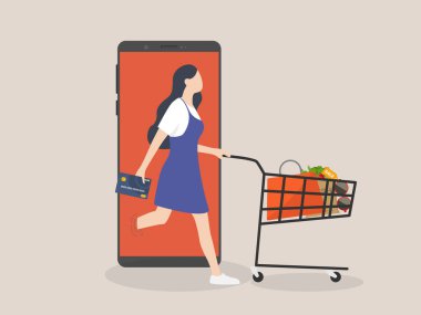 Çevrimiçi alışveriş veya mobil alışveriş uygulaması konsepti, kredi kartı taşıyan kadın tüketiciler alışveriş arabalarında alışveriş arabaları veya cep telefonlarında çalışan uygulamalarla dolu malları itiyor.