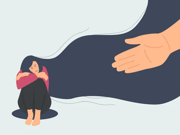 Akıl sağlığı konsepti. İnsan eli depresyondaki üzgün genç kıza yardım eder. Oturur ve dizlerine sarılırdı..