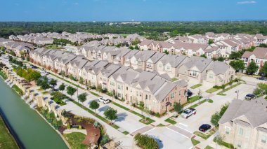 New development riverside townhomes and apartment complex in downtown Flower Mound, Texas, USA clipart
