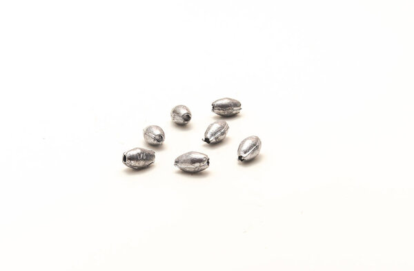 Group of silver egg sinkers fishing accessories isolated on white background. Ideal for Carolina rigging allow anglers to get down deep for ground bottom fishing