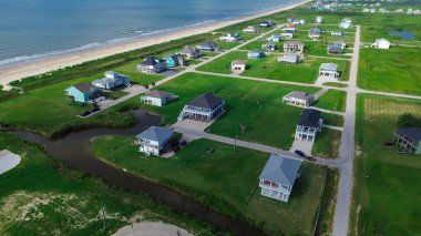 Açık deniz manzaralı, yarı kırsal sel bilinci olan, yarı kırsal, yarı taşkın bilinçli, açık deniz manzaralı, plaj boytu, Port Bolivar, Texas. ABD