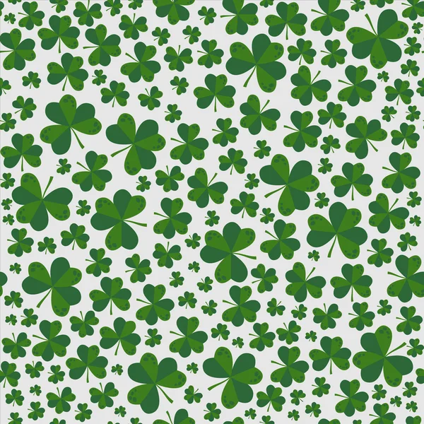 Motif vectoriel sans couture avec des trèfles le jour de saint Patrick, vert sur fond blanc — Image vectorielle