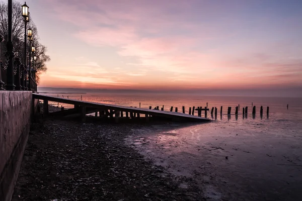 Sunset on the old pier — Stock Photo, Image