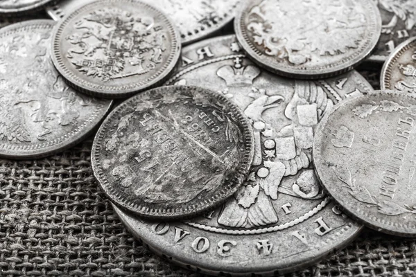 Silver coins on a sacking — Stock Photo, Image