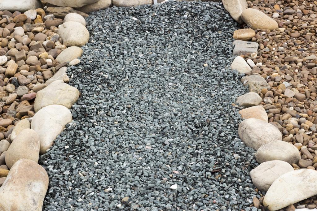 Chippings and gravel of marble and sandstone colored Stock Photo by