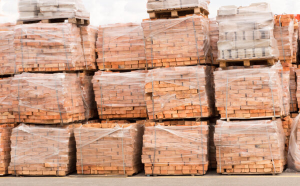 trays sealed with red brick and stacked