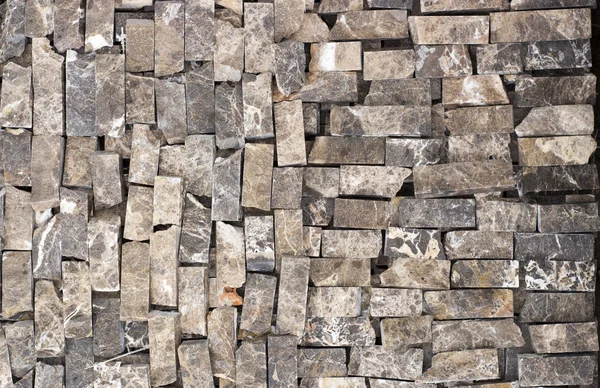 Texture of marble facing bricks chipped close-up — Stock Photo, Image