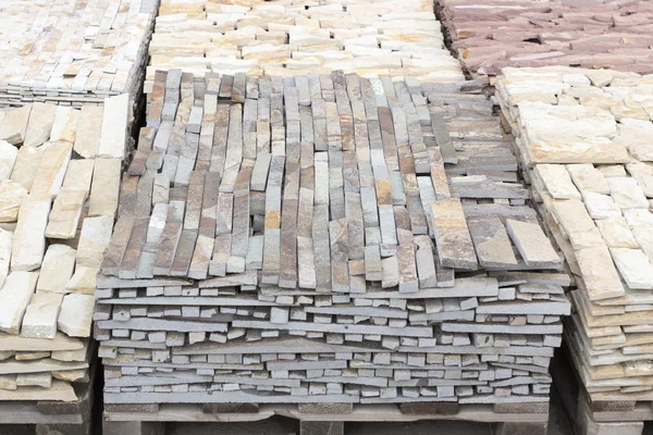 Trays of multicolored marble facing brick in the range — Stock Photo, Image