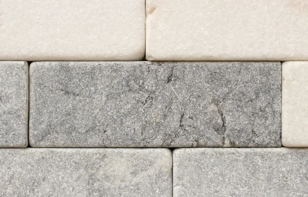 Textura de ladrillos de revestimiento de mármol astillado primer plano — Foto de Stock