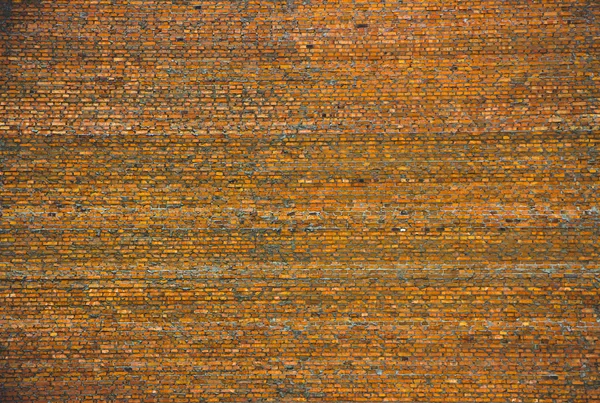 Parede de tijolo vermelho velho com muita textura e cor — Fotografia de Stock