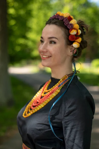 Young attractive woman in a wreath, portrait — Stock Photo, Image