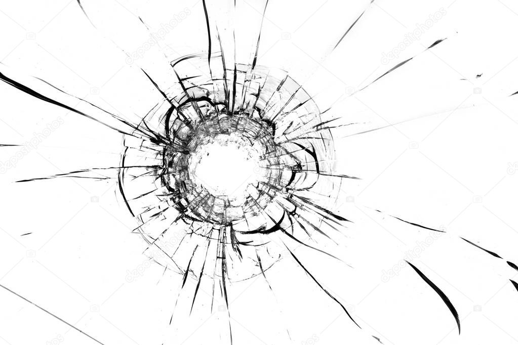 Cracks in the glass, a hole from the bullets in the glass on a white background. Window glass texture.