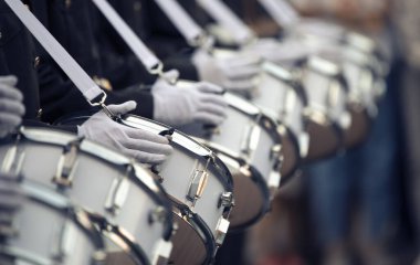 Military drummers play drums. Close-up selective focus. clipart