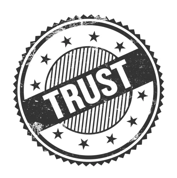 Siyah grungy zig zag kenarlarında yazılmış TRust metni yuvarlak pul.