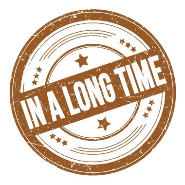 Kahverengi yuvarlak dokuma damgası üzerine uzun bir Time metni.