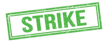 Yeşil grungy vintage dikdörtgen damgalı STRIKE metni.
