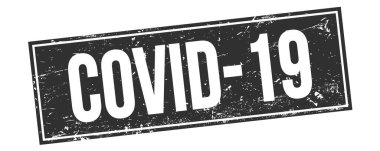 Siyah grungy dikdörtgen mühür işareti üzerinde COVID-19 metin.