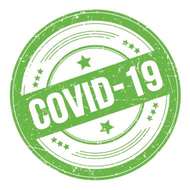 Yeşil yuvarlak grungy desen damgası üzerine COVID-19 metin.
