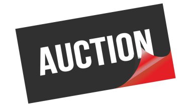 Açık Artırma metni siyah kırmızı etiket damgası üzerine yazılmış.