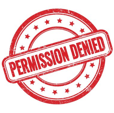 Kırmızı, eski, pasaklı, yuvarlak kauçuk damga üzerine GÖREVLİ metin.