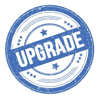 Mavi yuvarlak grungy doku damgası üzerine UPGRAD metni.