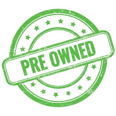 Yeşil, antika, yuvarlak, lastik damga üzerine PRE OWNED metin.