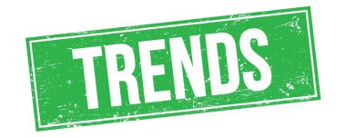 Yeşil grungy dikdörtgen damga işareti üzerinde TRENDS metin.