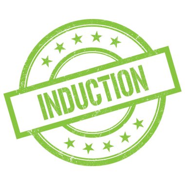 Yeşil yuvarlak vintage kauçuk damga üzerine yazılmış INDUCTION metin.
