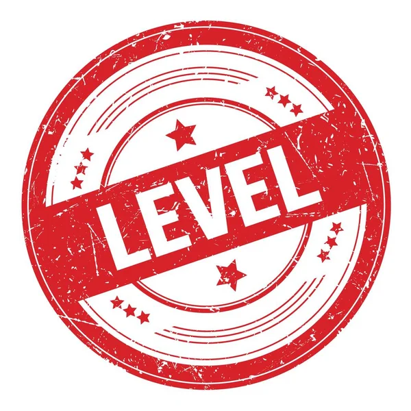 Kırmızı yuvarlak grungy desen damgası üzerine LEVEL metin.